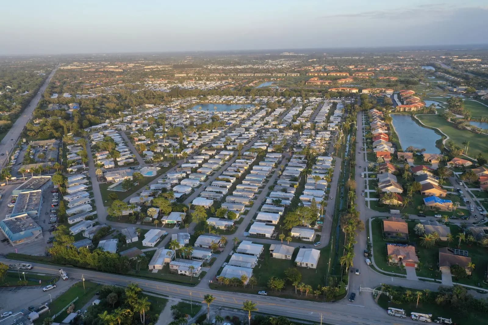 Aerial view of a suburban neighborhood with lakes and tree-lined streets