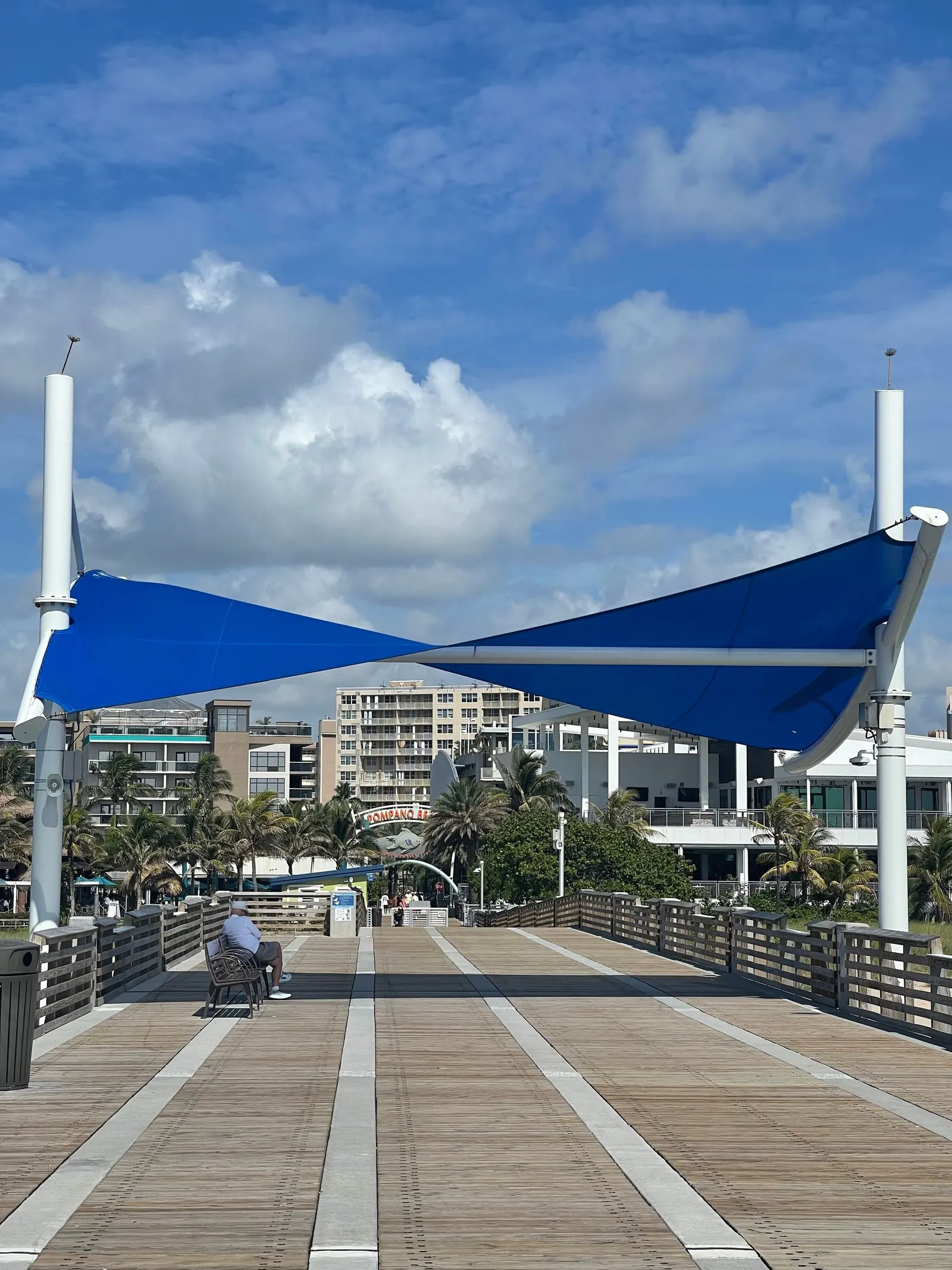 Pier boardwalk with blue shade sails