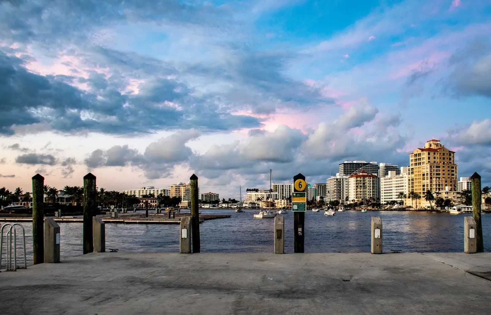 Downtown skyline seen from a waterfront dock at dusk