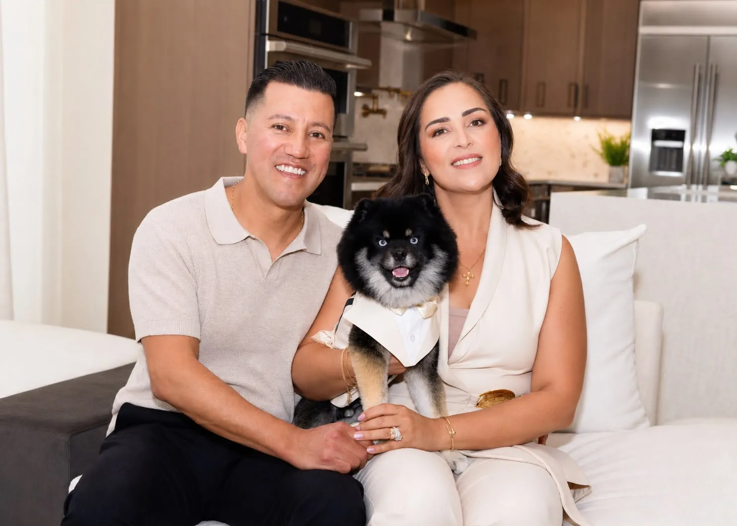 Gabriela Rocha Ramalho at home with her husband and their dog